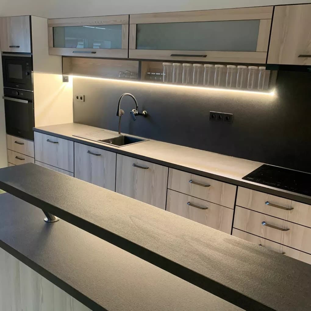 Custom solid wood kitchen cabinetry with built-in workspace and storage